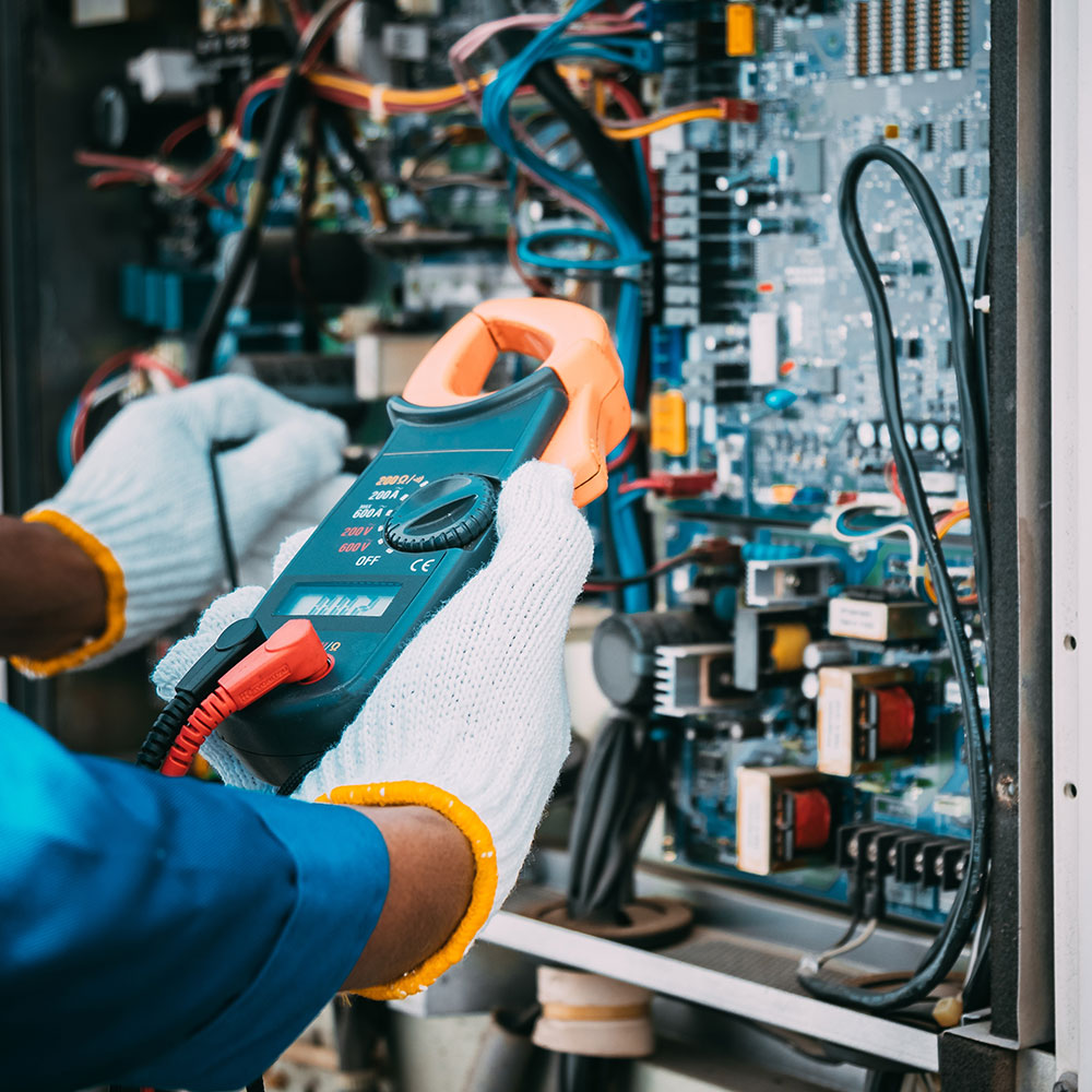 An engineer configuring the voltage of an electrical system